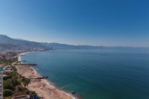 On the beach, sun loungers, beach towels