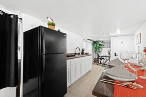 Fridge, microwave, stovetop, coffee/tea maker