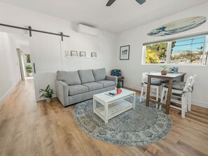 Premier Apartment, City View | Living area | 50-inch Smart TV with cable channels - Rise Suites Oceanside (Oceanside)