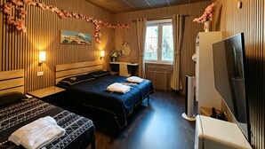 A hotel room with two beds, a desk, a TV, and a window with curtains. - BED & BREAKFAST SAKURA (Milan)
