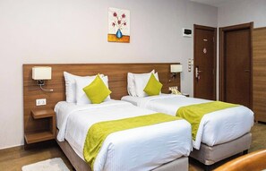 Twin Room, Resort View | Minibar, in-room safe, desk, laptop workspace - Ah Hotel and Conferences (Accra)