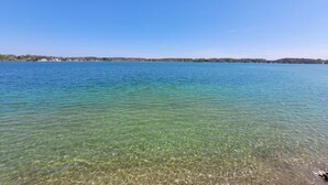 A clear view of a lake with a distant shoreline. - Lake Gage Getaway,
Where every season feels like a vacation. (Angola)