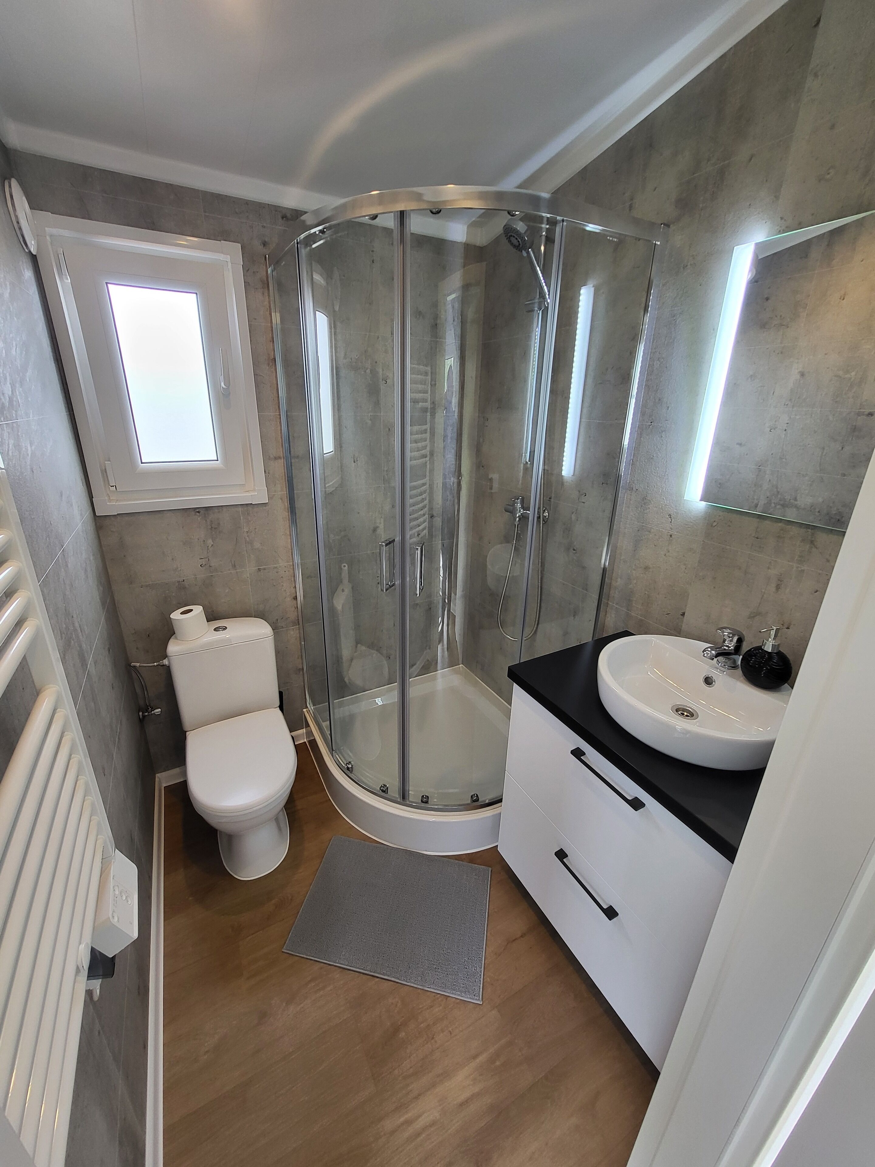 Shower, towels, soap, toilet paper