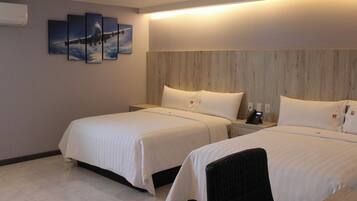 Habitación doble Deluxe | Ropa de cama de alta calidad y edredón
