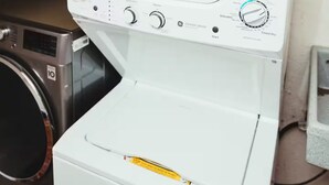 A front-loading washing machine with multiple control knobs and settings. - Apartments cabos 1 (San José del Cabo)