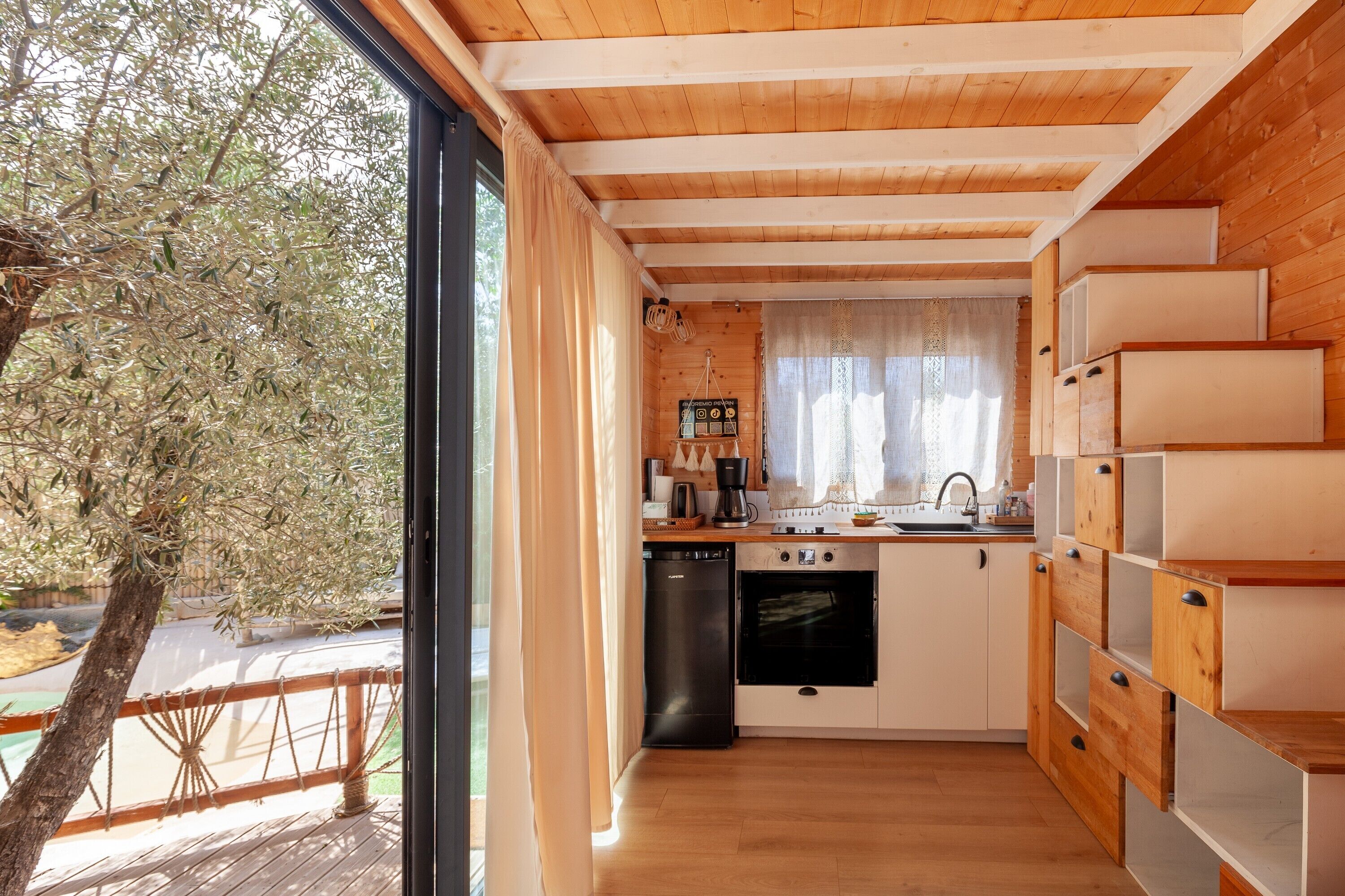 Fridge, oven, coffee/tea maker, cookware/dishes/utensils