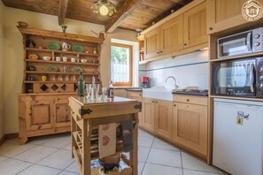 Microwave, highchair, cookware/dishes/utensils, spices