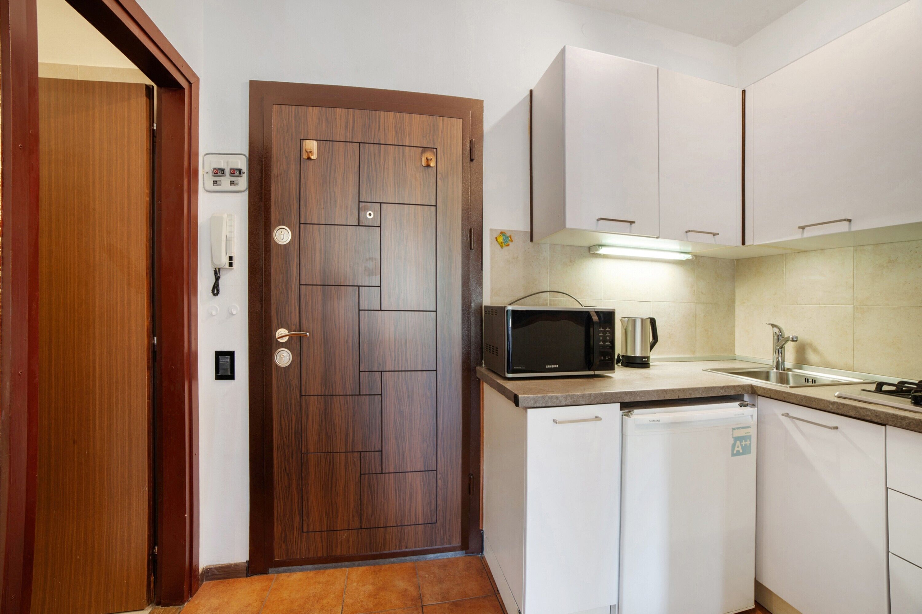 Fridge, microwave, stovetop, coffee/tea maker