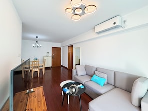 Condo, City View | Living area | 55-cm TV with digital channels