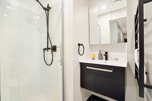 Shower, hair dryer, towels, soap
