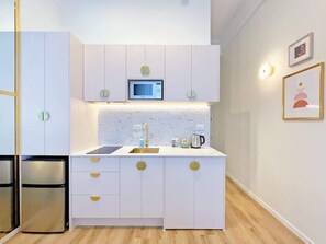 Fridge, microwave, stovetop, coffee/tea maker