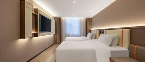 Executive Twin kamer | Donzen dekbedden, een gratis minibar, een laptopwerkplek