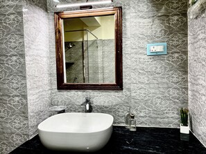 Shower, towels, soap, toilet paper