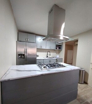 Fridge, microwave, stovetop, coffee/tea maker