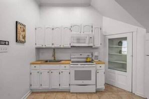 Fridge, stovetop, coffee/tea maker, cookware/dishes/utensils