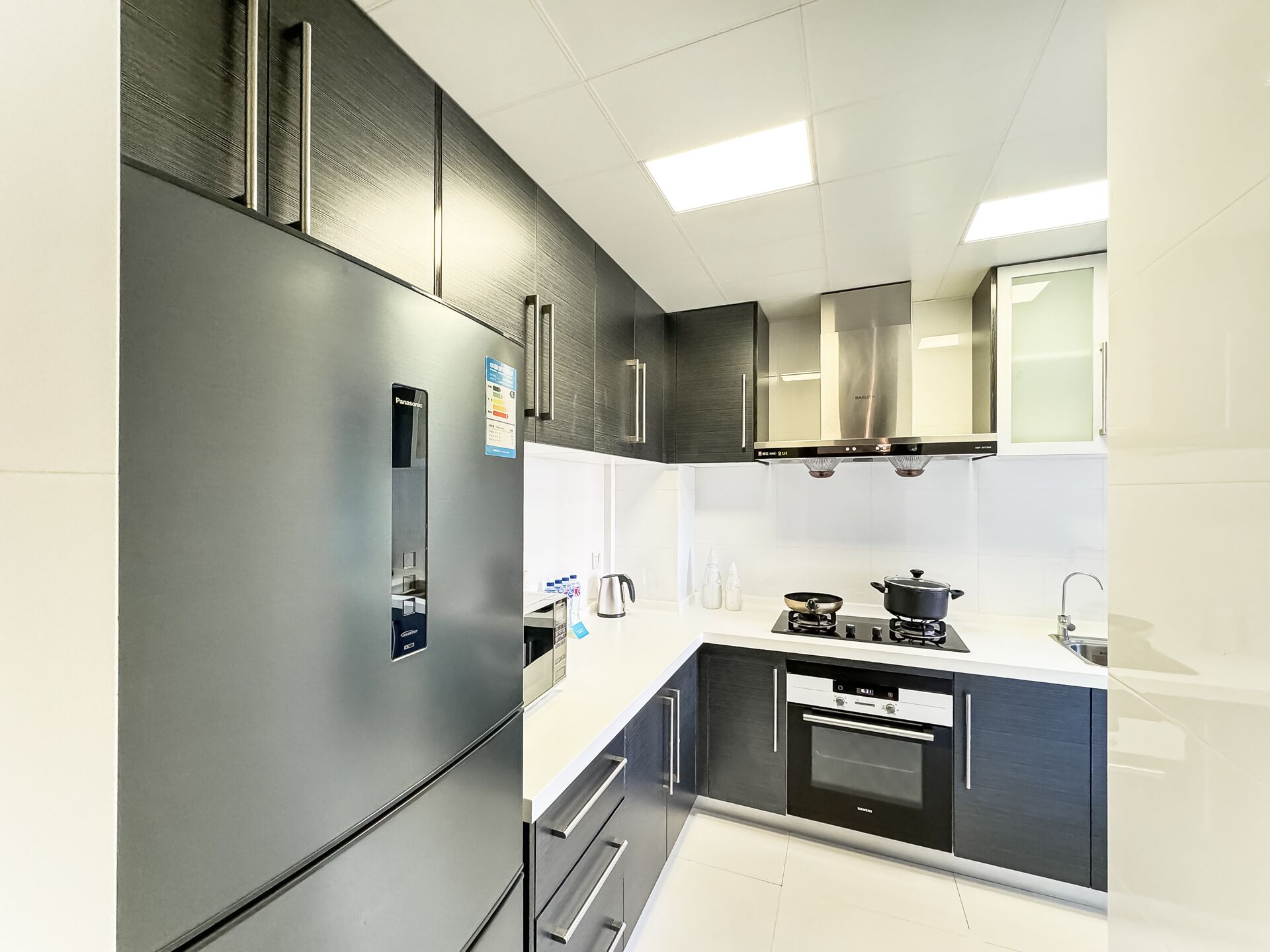 Condo, Balcony, City View | Private kitchen | Fridge, microwave, stovetop, rice cooker