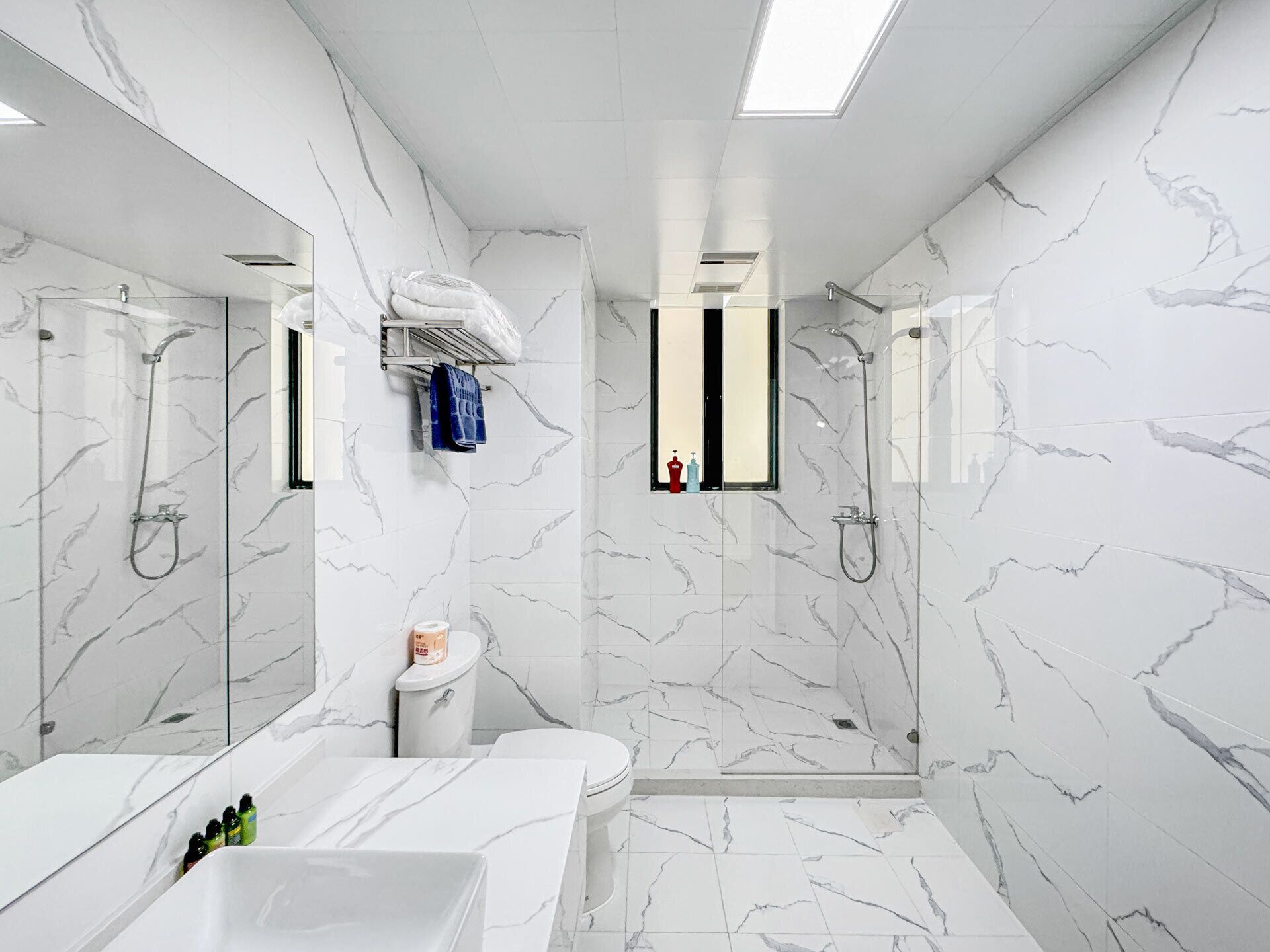 Condo, Balcony, City View | Bathroom | Designer toiletries, hair dryer, slippers, towels