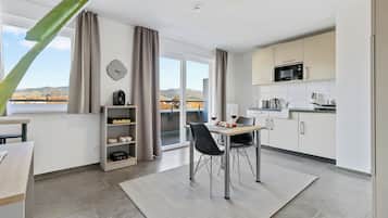 Deluxe Duplex, Balcony, Mountain View | Private kitchen | Full-size fridge, microwave, stovetop, cookware/dishes/utensils