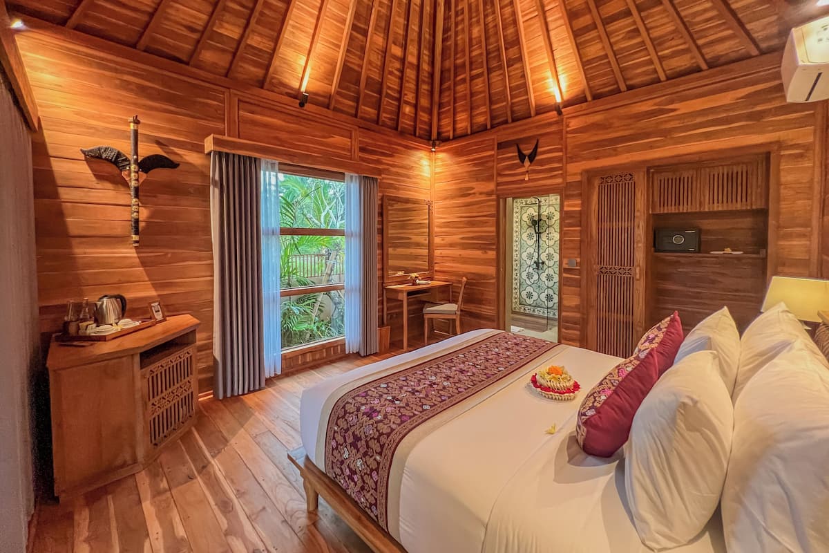 Suite, 1 chambre, vue jardin | Minibar, coffres-forts dans les chambres, bureau, Wi-Fi gratuit
