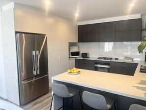 Fridge, microwave, oven, stovetop - This beautiful home is only a short 5-minute walk to the beach, pier, pub. (St Leonards)