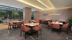 A modern restaurant with glass walls, marble flooring, and orange chairs. - chengduchengguojiudian (Chengdu)