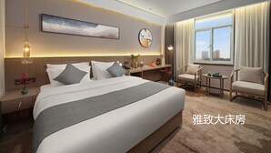 A modern hotel room with a large bed, a desk, a chair, and a view of the city. - chengduchengguojiudian (Chengdu)