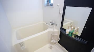 Separate bathtub and shower, free toiletries, hair dryer, towels
