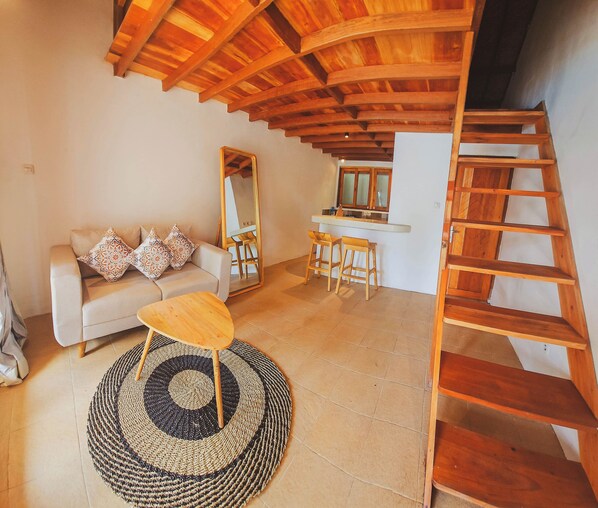 Chambre Deluxe, 1 chambre, en front de plage | Coin séjour