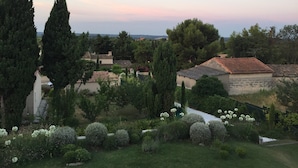 A residential area with houses, trees, and a garden.