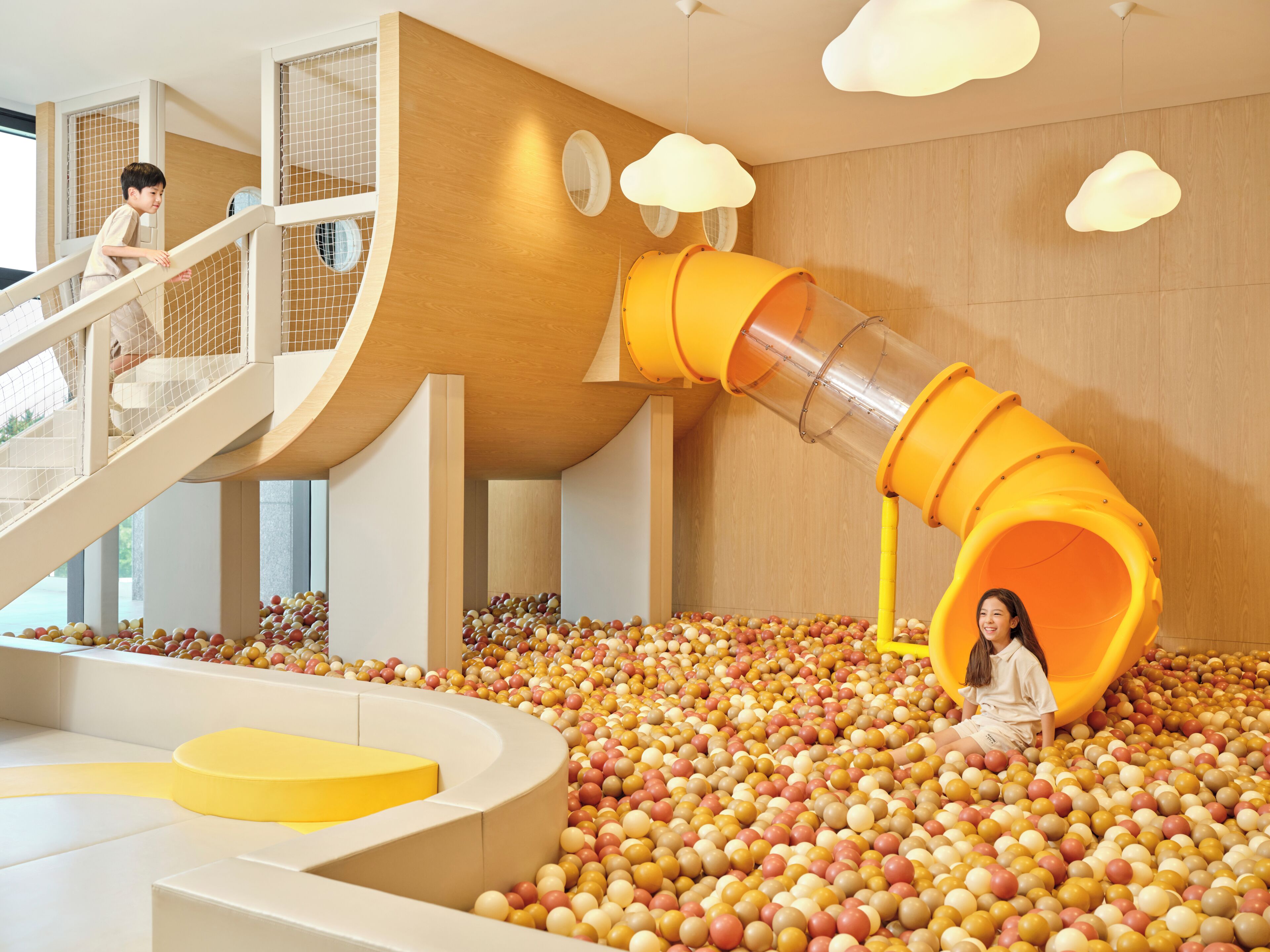 A play area with a ball pit and a slide.