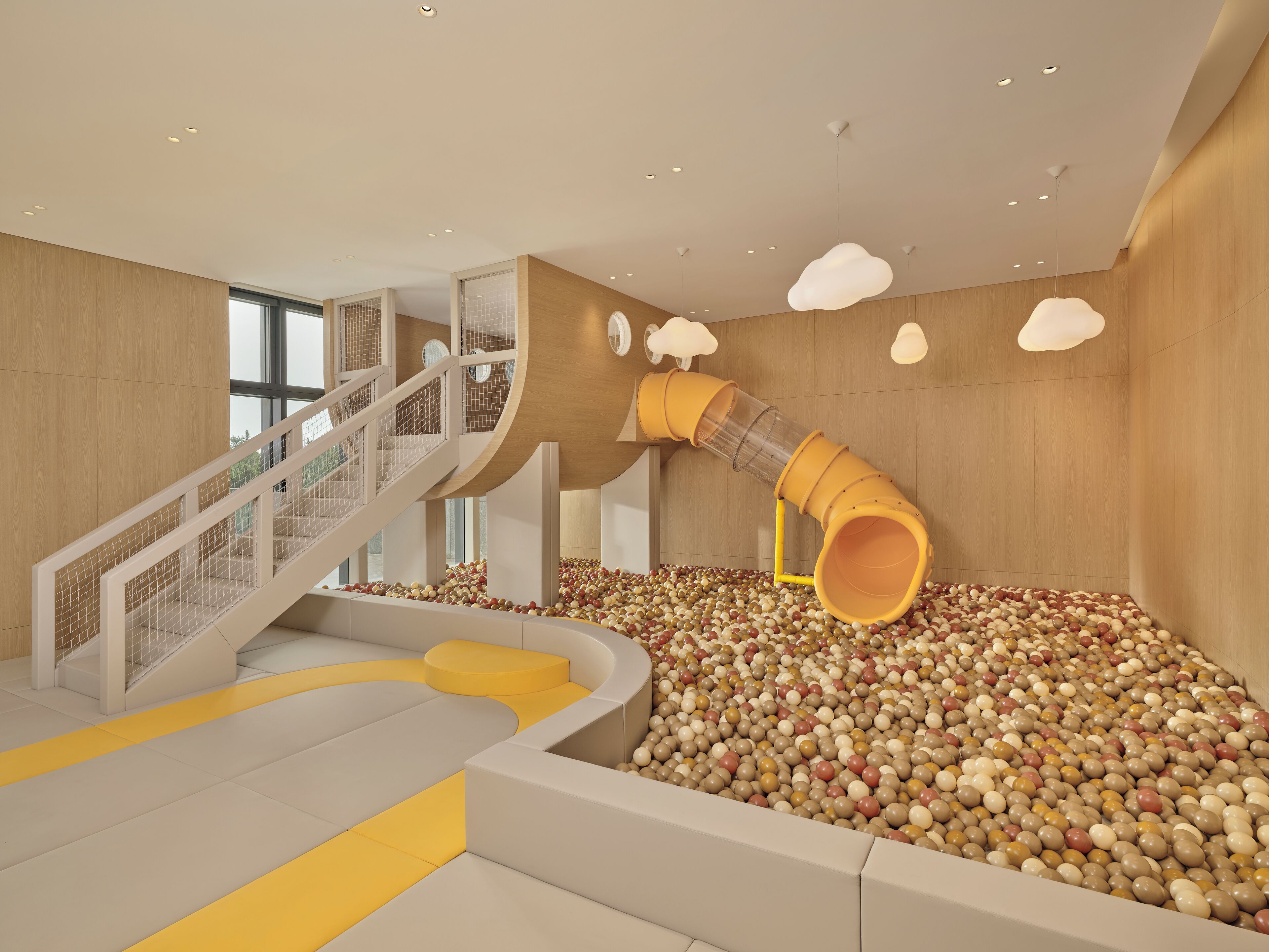 A play area with a slide and ball pit.