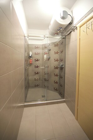 Shower, hair dryer, towels, soap