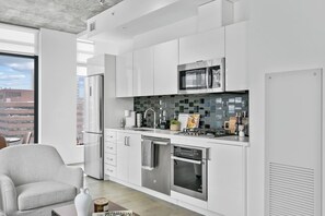 Microwave, stovetop, coffee/tea maker, cookware/dishes/utensils