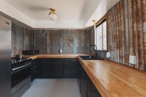 Fridge, oven, coffee/tea maker, cookware/dishes/utensils