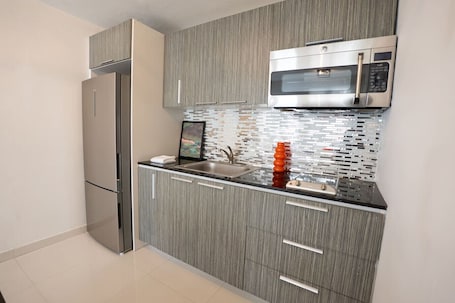 Fridge, microwave, stovetop, cookware/dishes/utensils