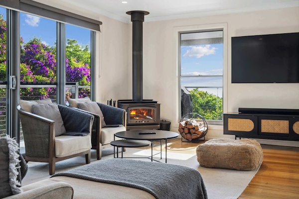 Relax fireside in the spacious living area with a good book or stream a movie on the 65" Smart TV.