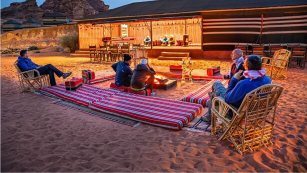 A desert setting with a stage and seating area for an outdoor event. - Wadi Rum Heritage (Wadi Rum)