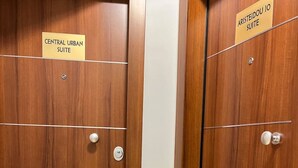 Two wooden doors with labels indicating 'Central Urban Suite' and 'Aristeidou 10 Suite'. - Aristidou 10 Suite by Zeus suites (Athina)