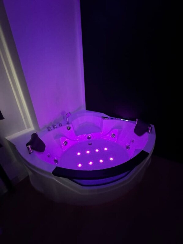 A hot tub with multiple jets and LED lights. - Jacuzzi Platinum Tsakalof 17 (Athina)