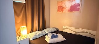 Bay Mau Homestay l Cozy 2BR Exclusive House with generator • Near Dahican beach