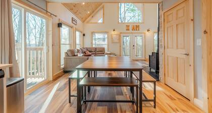 Peaceful A-frame cabin with hot tub, forest views, modern comfort, and total privacy in nature.