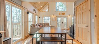 Peaceful A-frame cabin with hot tub, forest views, modern comfort, and total privacy in nature.
