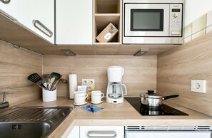 Fridge, microwave, stovetop, coffee/tea maker
