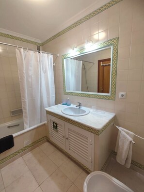 Hair dryer, bidet, towels, soap