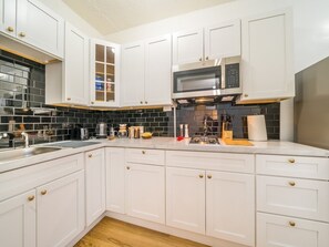 Fridge, microwave, stovetop, coffee/tea maker