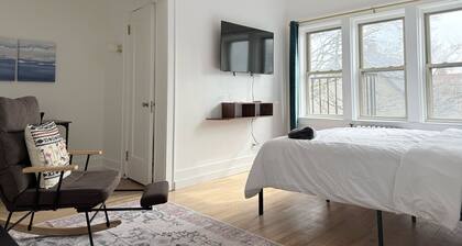 Modern studio in Downtown Rochester with a full kitchen and Smart TV, steps from High Falls.