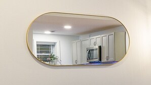 A kitchen with white cabinets, a microwave, and a blue countertop. - Cornhill1BED,Cozy,WiFi_EquipKitchen_TV+HighFalls (Rochester)