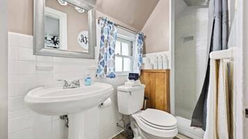 Shower, hair dryer, towels, shampoo