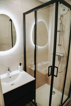 Shower, hair dryer, towels, soap