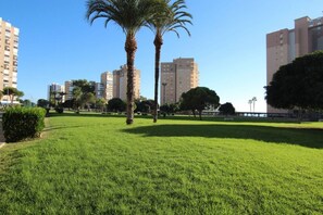 Stroll through this serene urban oasis, surrounded by lush greenery and towering residential buildings.